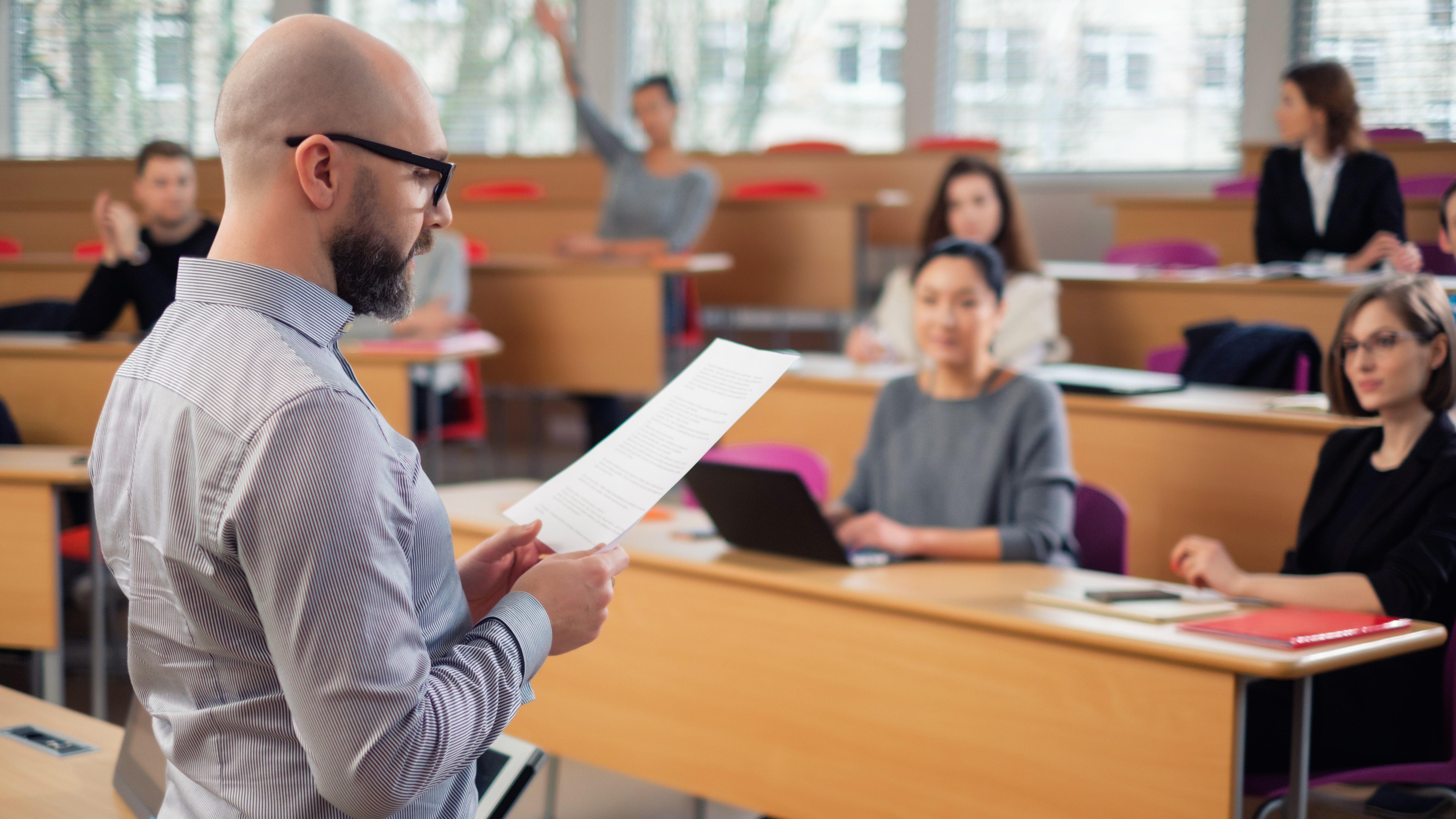 Instructor reading syllabus to class.